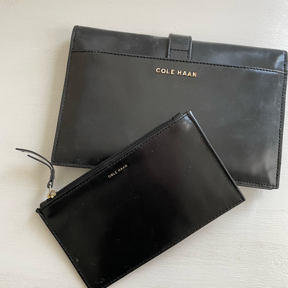 Cole Haan black leather slim clutch and matching zip case..gold detail ..